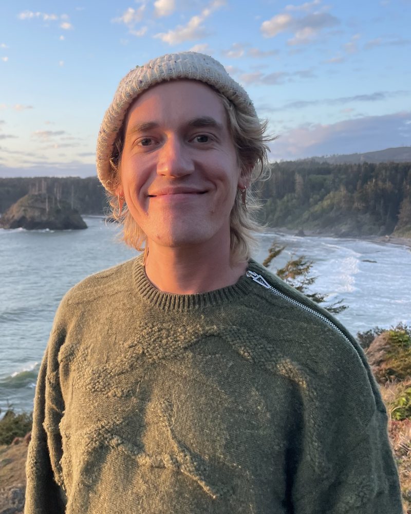 Ransom Mowris, founder of Sempervirens Automation, on a cliff above the Pacific coast